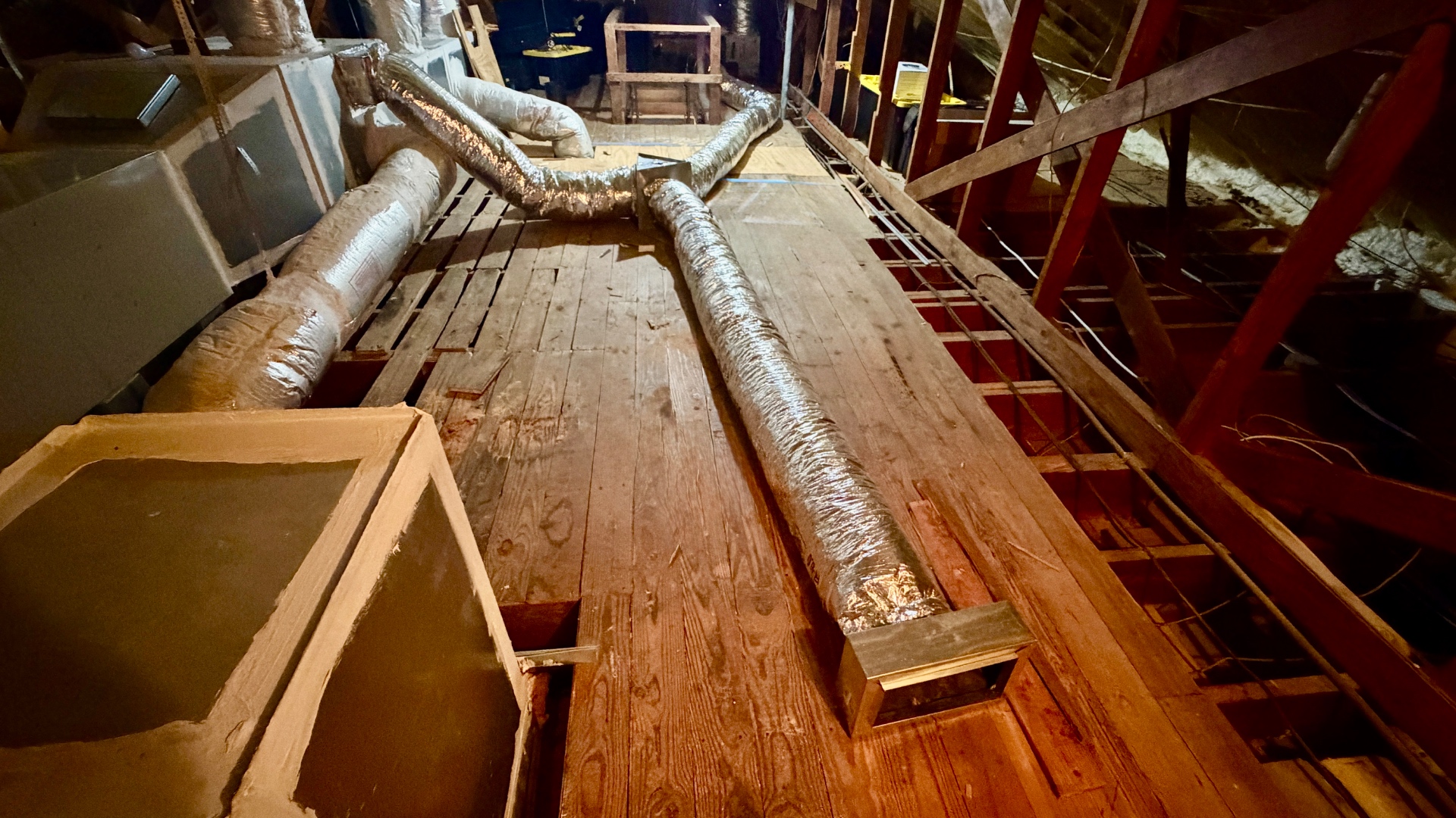 Added flexible supply duct branches extending through the attic.