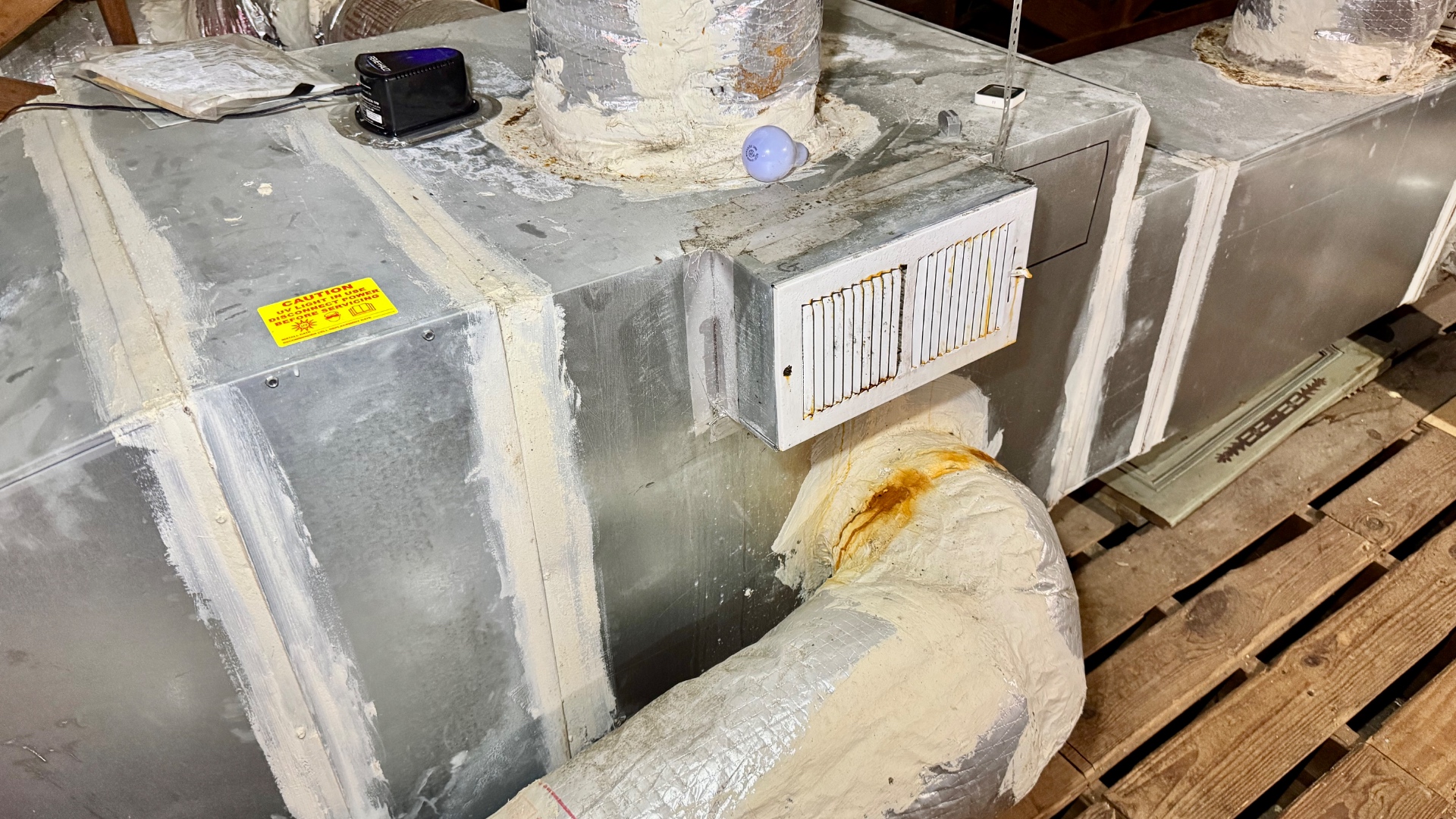 Original local supply-air branch at the duct plenum.